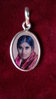 Locket silver big with foto of Mother Meera (front) and Durga (backside)